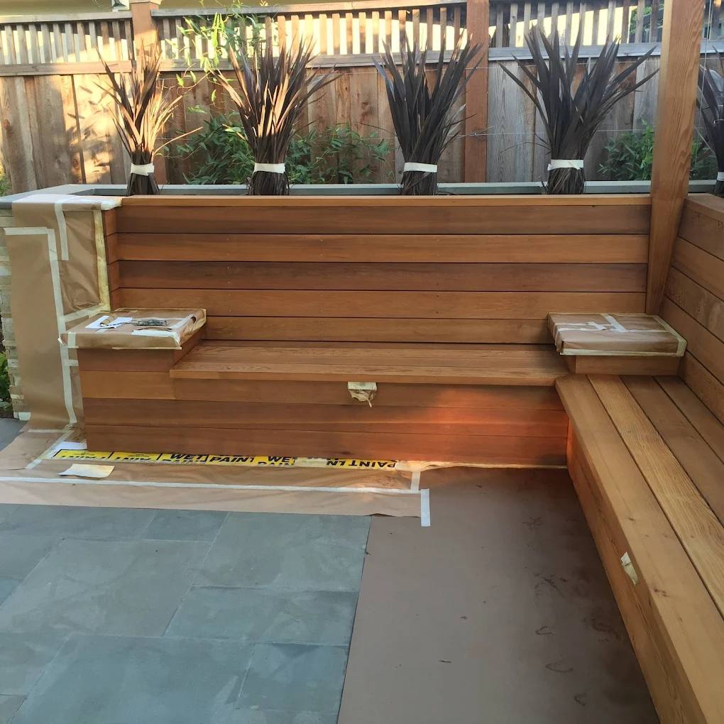 Cedar deck and built-in bench being stained