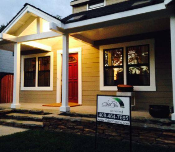 Color Pros yard sign on the porch of a freshly painted craftsman home