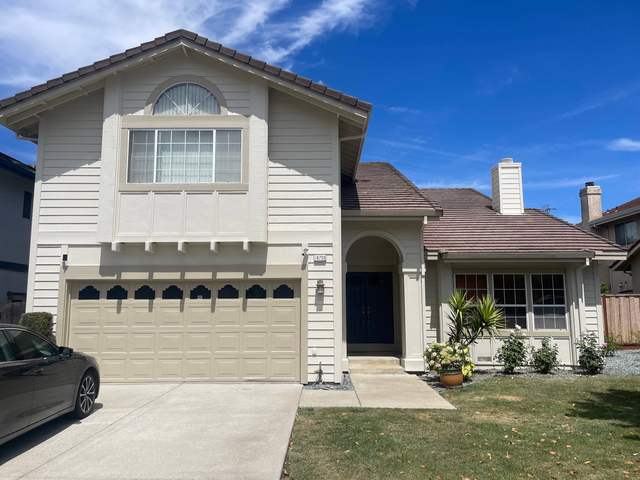 Cream two-story home after exterior painting