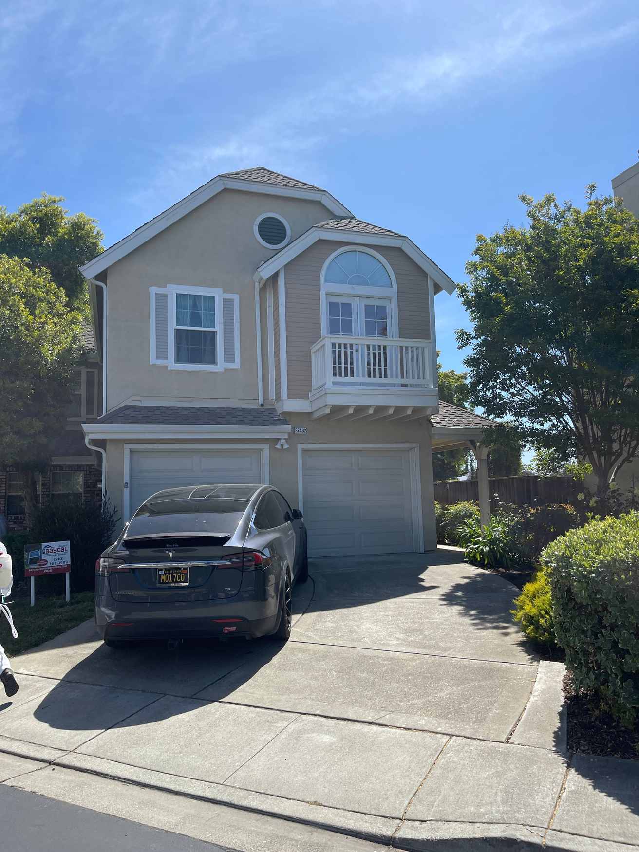 Tall two-story home with a fresh exterior paint job
