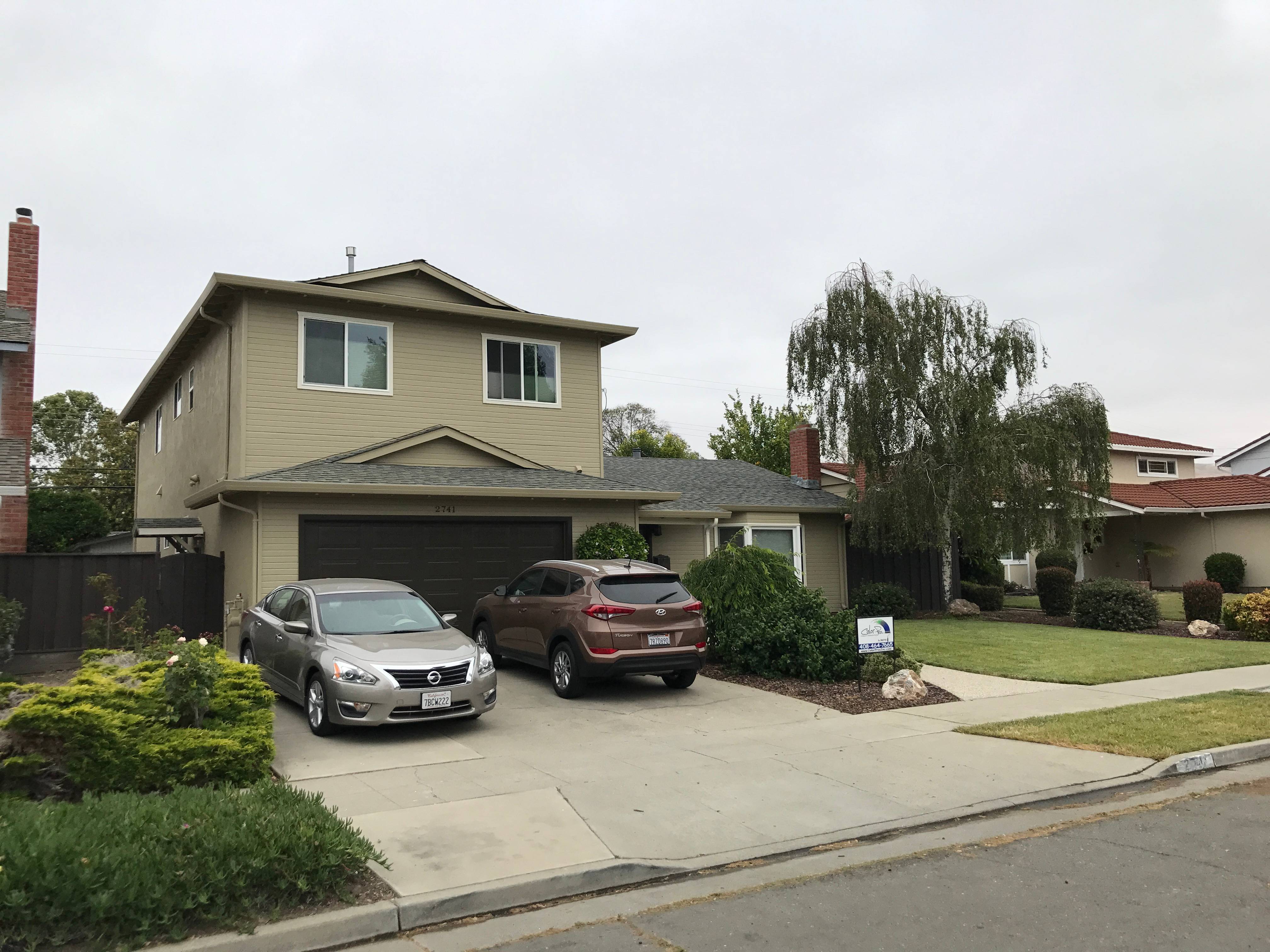 Two-story residential exterior painting