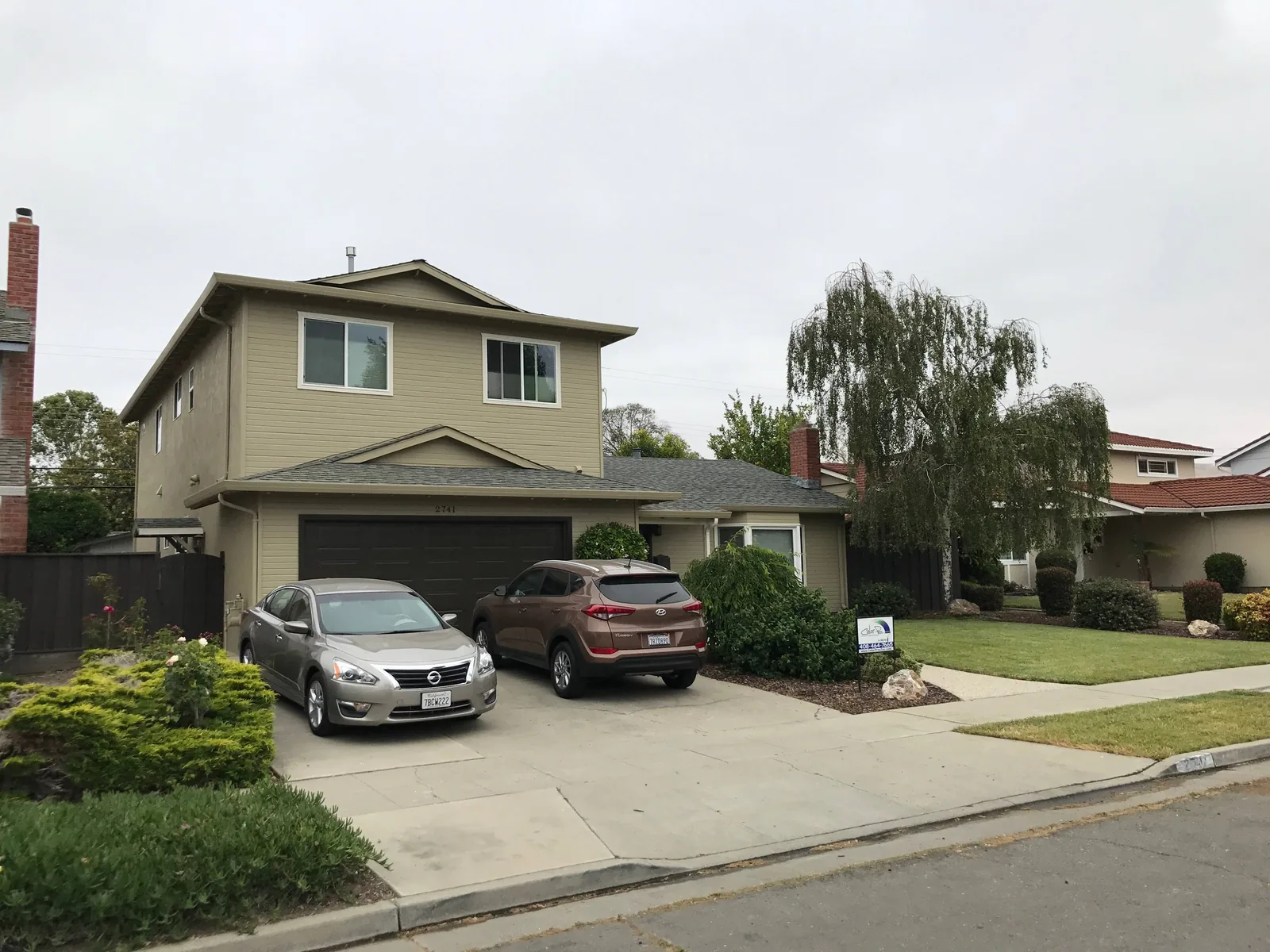 Two-story residential exterior painting